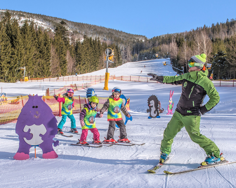 Into the mountains with small mountain skiers